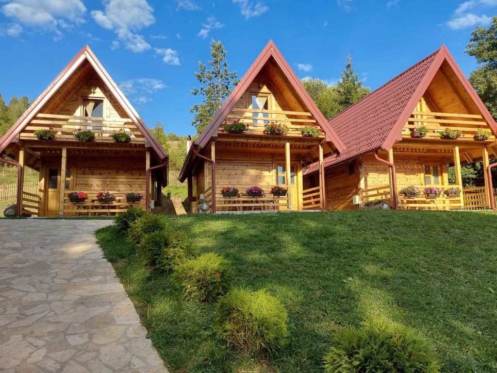 The apartment complex consists of three wooden houses